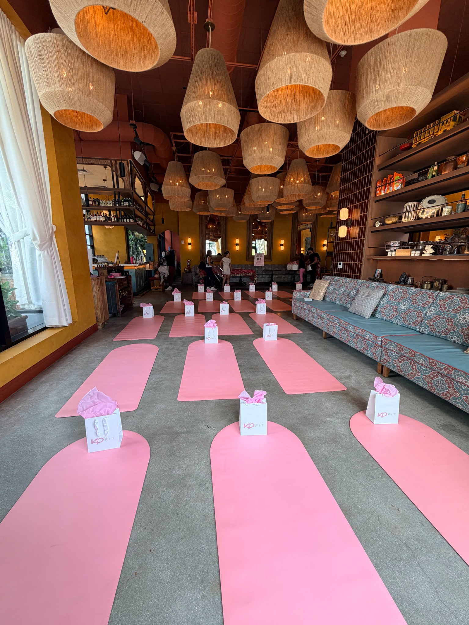 Pink mat and welcome-gift setup for a private event